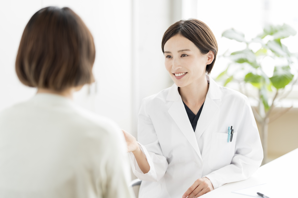 Female provider consulting with a patient about HRT for women treatment options